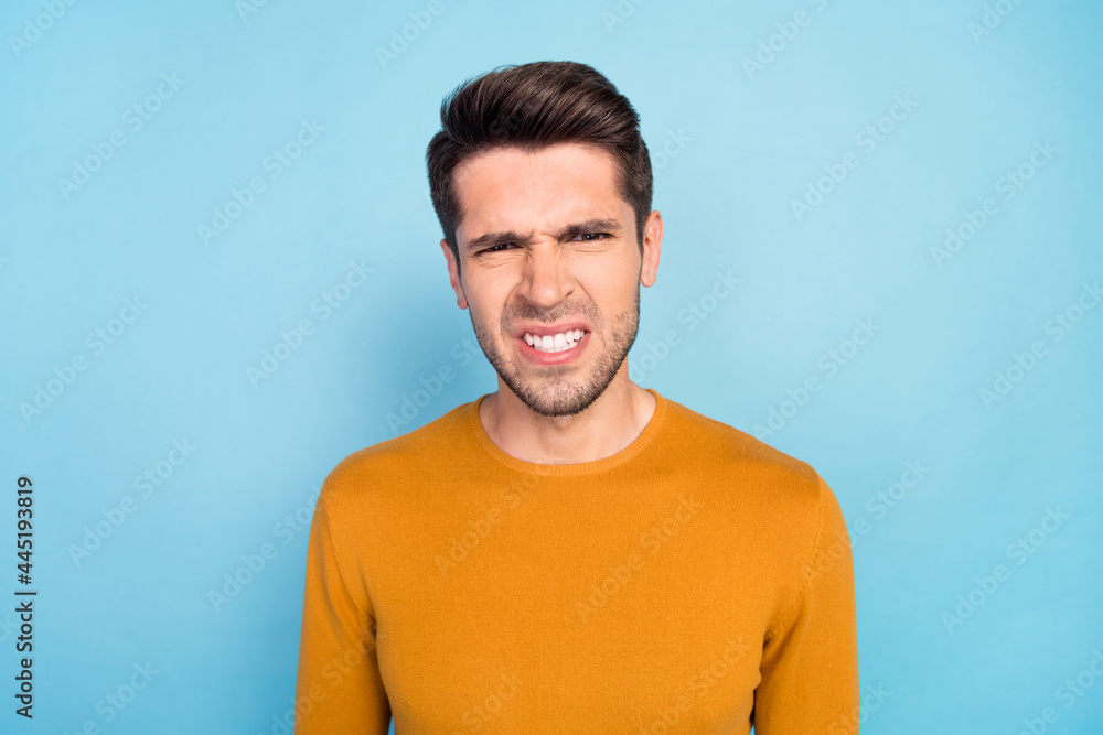 Fototapeta premium Photo of angry brunet millennial guy wear brown shirt isolated on blue color background
