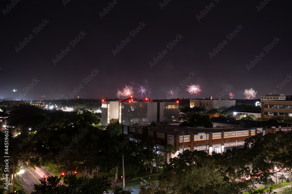 St Petersburg, FL, USA - 07 04 2021: Fireworks and night landscape of  in St Petersburg, Florida