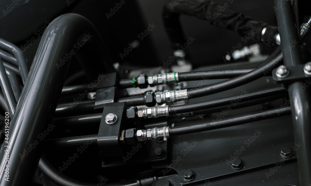 Banner with close up view of hydraulic pipes of heavy industry machine. Low key. Banner with close up view of hydraulic pipes of heavy industry machine. Low key.