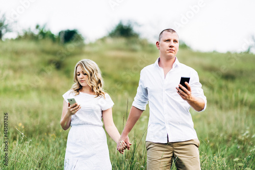 a guy with a girl in light clothes on the background of a green canyon