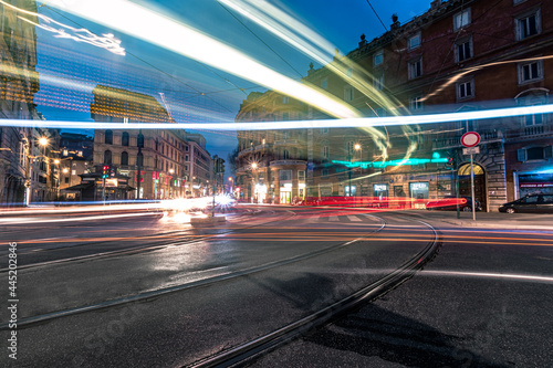 Fototapeta Naklejka Na Ścianę i Meble -  traffic at night. neon lights in the streets of Rome, Italy. Long exposure photography 