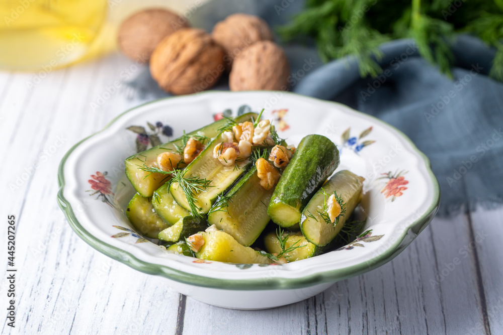 Green zucchini salad with walnuts and dill Green zucchini salad with walnuts and dill