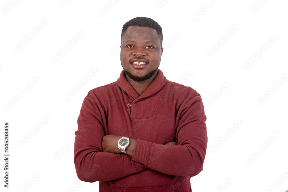 happy young man crossing his arms smiling. happy young man crossing his arms smiling.