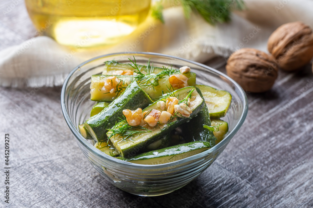 Green zucchini salad with walnuts and dill