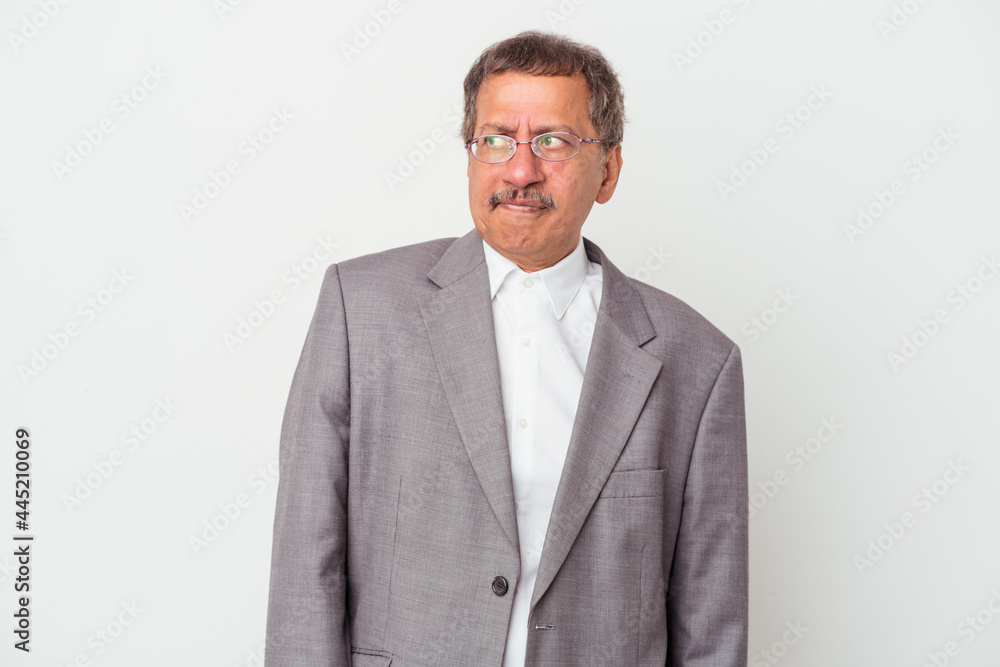 Middle aged indian business man isolated on white background confused, feels doubtful and unsure. Middle aged indian business man isolated on white background confused, feels doubtful and unsure.