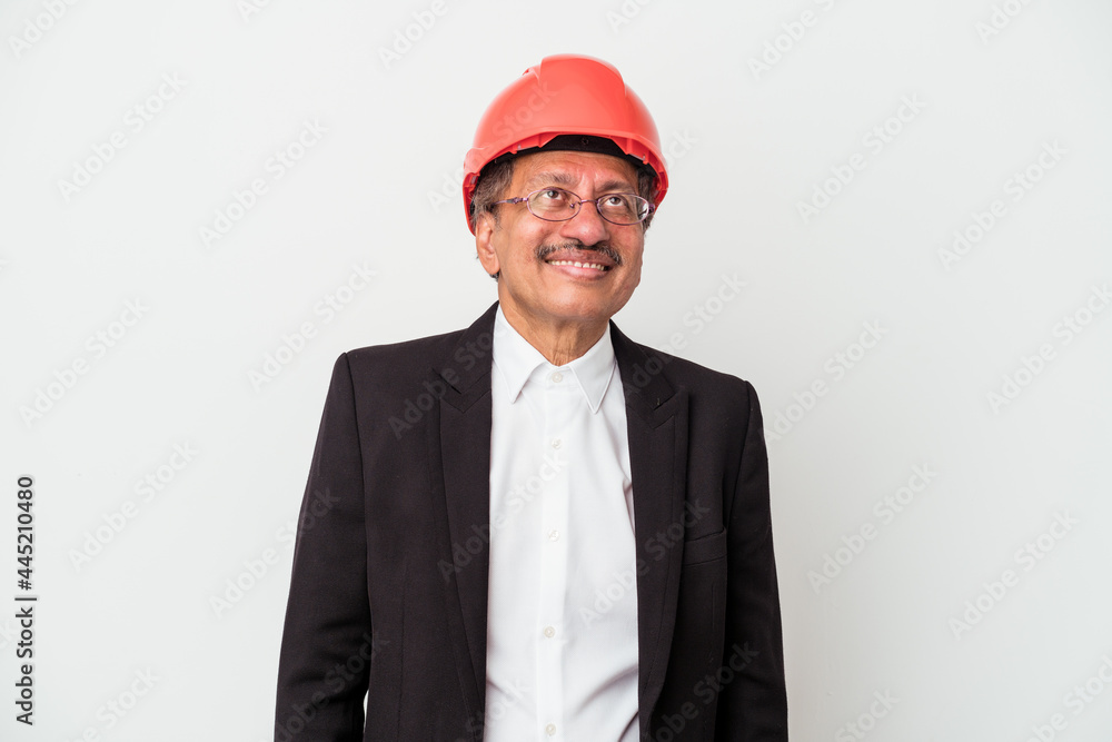 Middle aged indian architect man isolated on white background dreaming of achieving goals and purposes Middle aged indian architect man isolated on white background dreaming of achieving goals and purposes