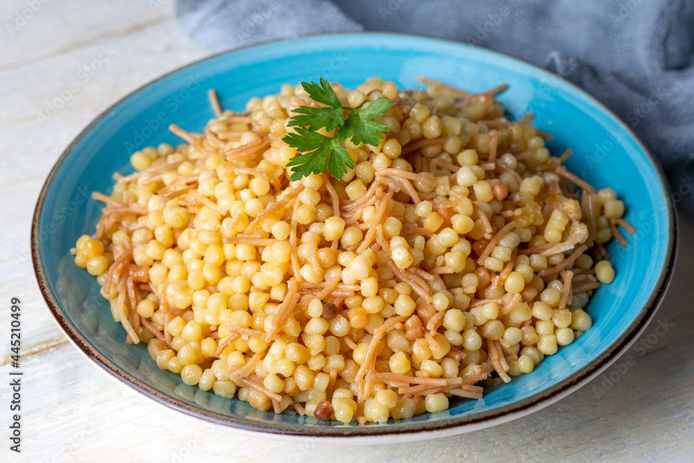 Traditional delicious Turkish food; Couscous pilaf with vermicelli (Turkish name; Sehriyeli kuskus pilavi) Traditional delicious Turkish food; Couscous pilaf with vermicelli (Turkish name; Sehriyeli kuskus pilavi)
