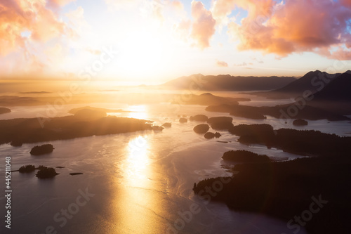 Aerial Canadian Landscape at the West Pacific Ocean Coast. Bright colorful vibrant sunset Art Render. Taken from Airplane in Tofino  Vancouver Island  British Columbia  Canada.