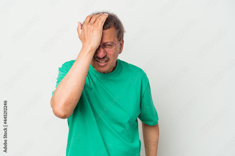 Middle aged indian man isolated on white background forgetting something, slapping forehead with palm and closing eyes. Middle aged indian man isolated on white background forgetting something, slapping forehead with palm and closing eyes.
