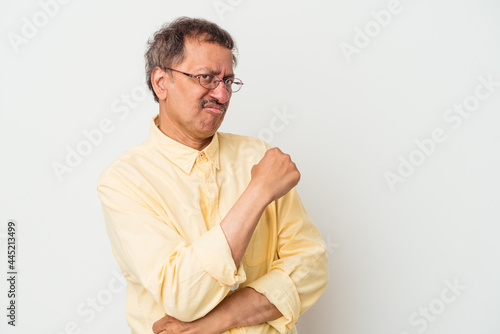 Middle aged indian man isolated on white background confused, feels doubtful and unsure.