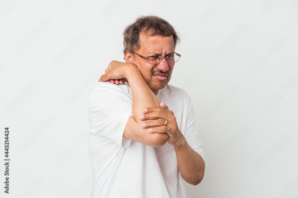 Middle aged indian man isolated on white background having a neck pain due to stress, massaging and touching it with hand. Middle aged indian man isolated on white background having a neck pain due to stress, massaging and touching it with hand.