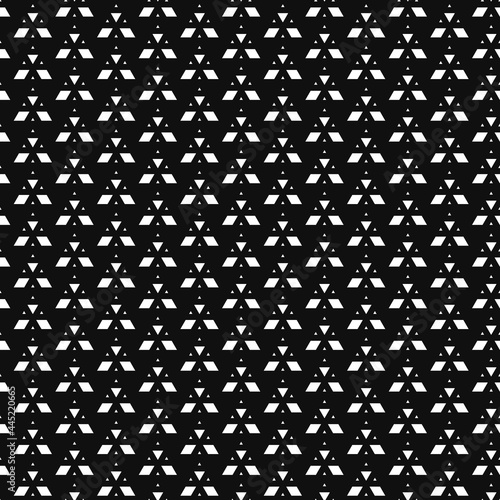 Geometric pyramid seamless pattern. White on black background. Fabric designs and wallpapers.