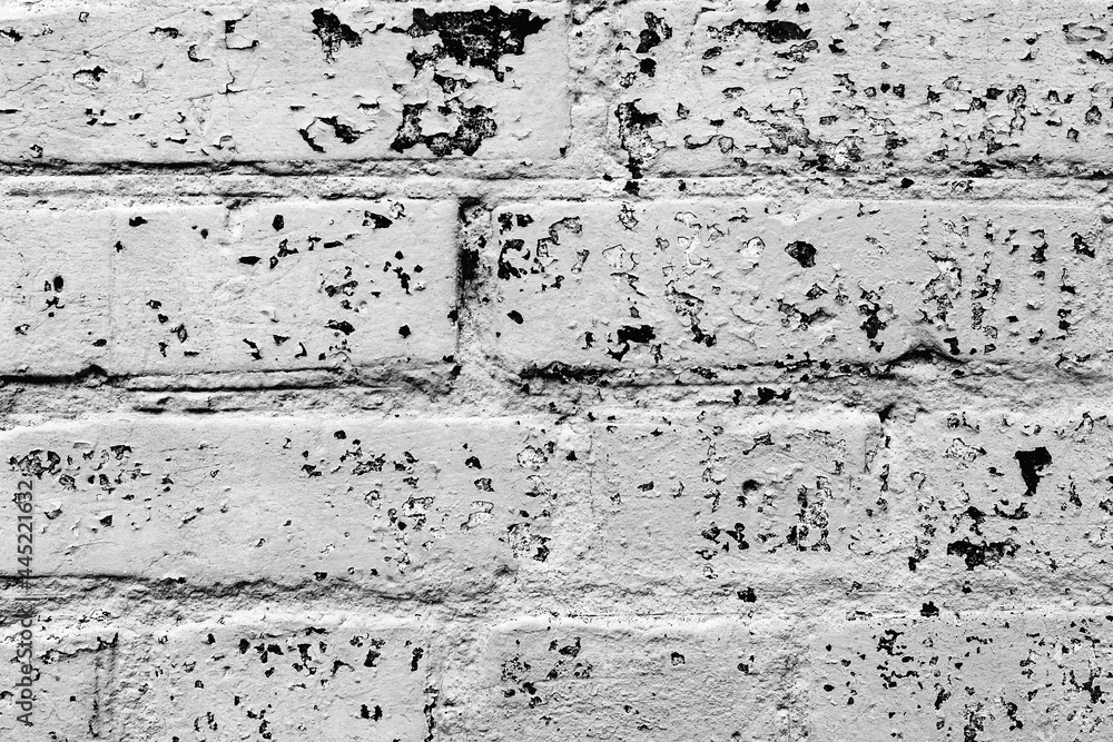 Obraz premium Texture of a brick wall with cracks and scratches which can be used as a background