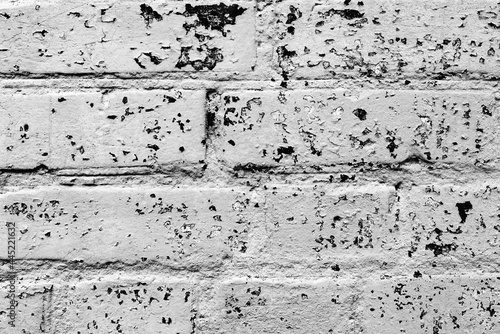 Texture of a brick wall with cracks and scratches which can be used as a background