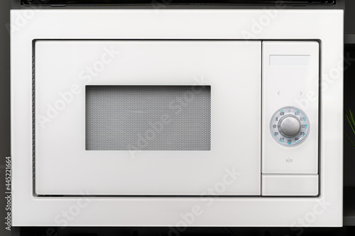 New modern microwave oven in a shop, close up