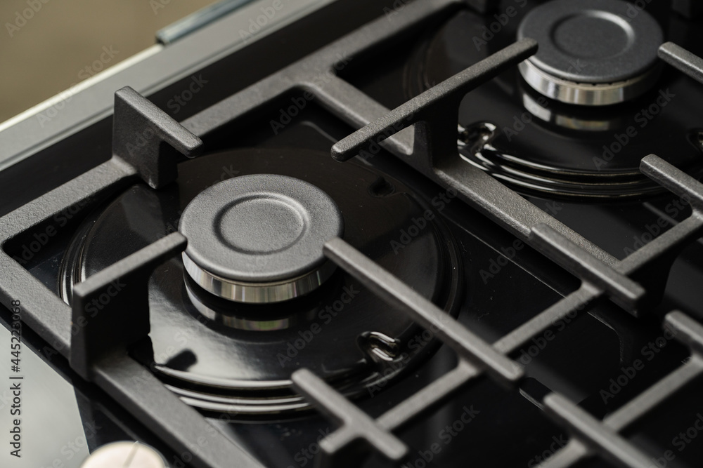 New modern shining metal gas cooker close up New modern shining metal gas cooker close up