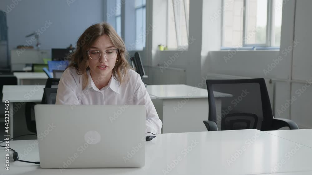 Young business lady explains something online Young business lady explains something online