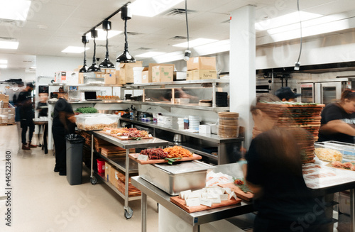 People Moving in a Busy Kitchen