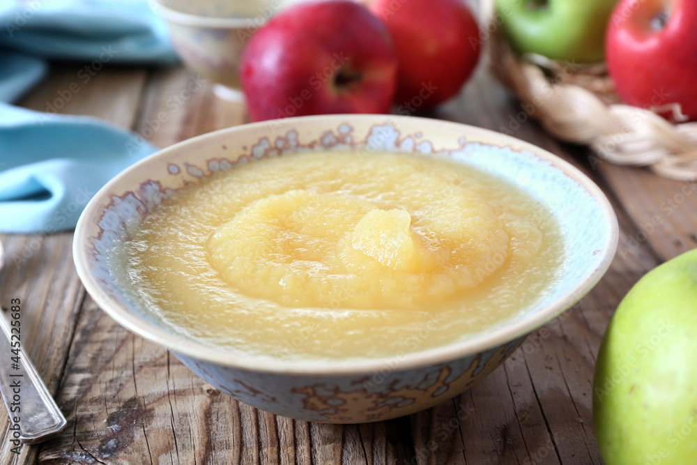 Healthy organic applesauce in ceramic bowl Healthy organic applesauce in ceramic bowl