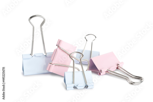 Colorful binder clips on white background. Stationery item