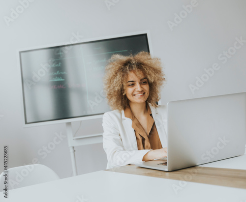 Young curly hair woman work...