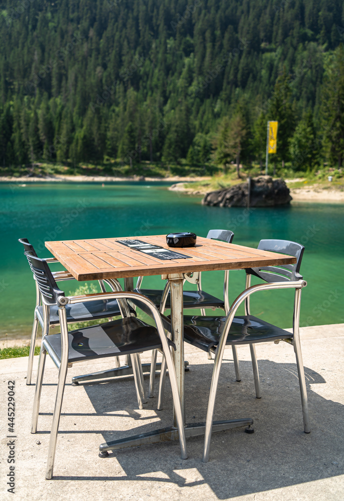 Restaurant table at the lake Caumasee is located in the southern part of the municipality of Flims in the Swiss canton of Graubunden.