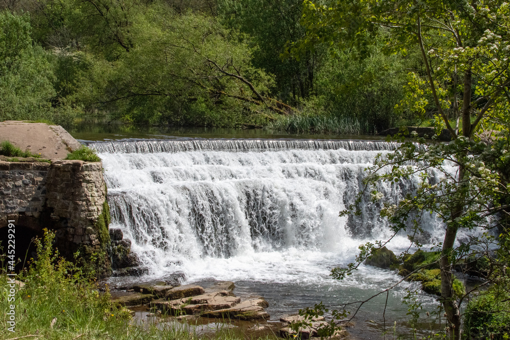 Monsal Dale Weir waterfall in Derbyshire, UK