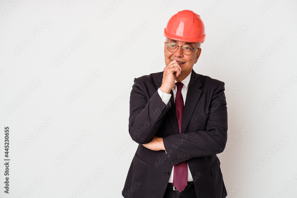 Senior american arquitech man isolated on white background relaxed thinking about something looking at a copy space. Senior american arquitech man isolated on white background relaxed thinking about something looking at a copy space.