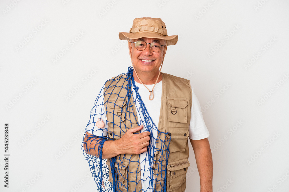 Senior american fisherman holding net isolated on white background happy, smiling and cheerful. Senior american fisherman holding net isolated on white background happy, smiling and cheerful.