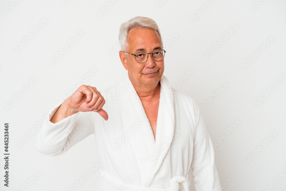 Senior american man wearing bathrobe isolated on white background showing a dislike gesture, thumbs down. Disagreement concept. Senior american man wearing bathrobe isolated on white background showing a dislike gesture, thumbs down. Disagreement concept.