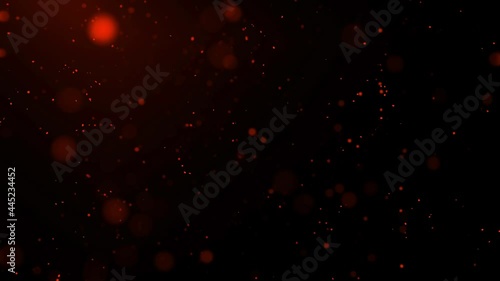 Rote Partikel oder roter Staub fliegen durch die Luft mit schwarzem Hintergrund