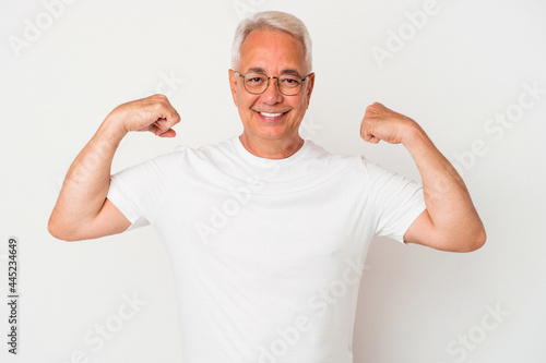 Tableau sur toile Senior american man isolated on white background showing strength gesture with a