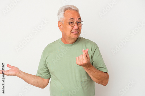 Senior american man isolated on white background showing that she has no money.