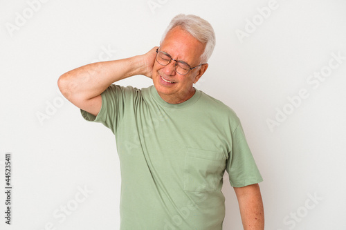 Senior american man isolated on white background tired and very sleepy keeping hand on head.