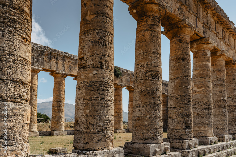 Doric Temple of Segesta,Sicily,Italy.European archeological historical site surrounded by green and quiet countryside.Summer holiday vacation concept.Sightseeing in Europe.Impressive cultural heritage
