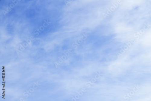 Cumulus, white clouds are softly and gently smeared across the blue sky in the atmosphere. The concept of freshness, pure oxygen, ozone and ecology. Background, wallpaper and copy space.