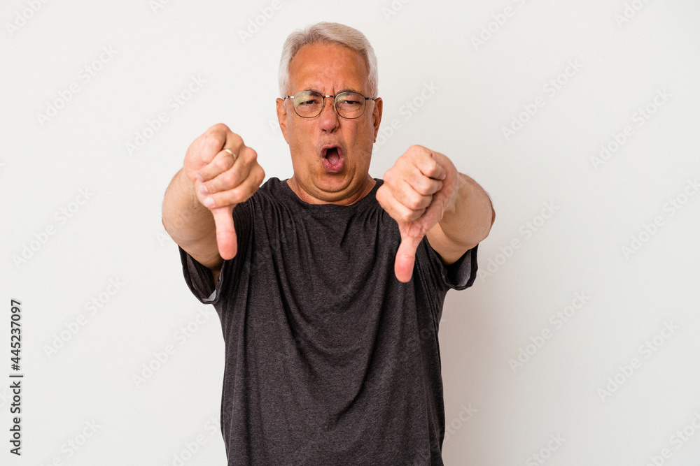 Senior american man isolated on white background showing thumb down and expressing dislike. Senior american man isolated on white background showing thumb down and expressing dislike.
