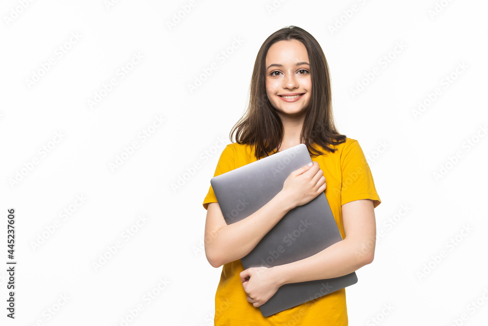 Successful woman holding a laptop over white Successful woman holding a laptop over white