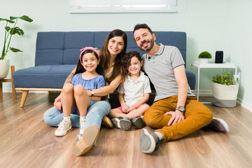 Portrait of a beautiful young latin family of four