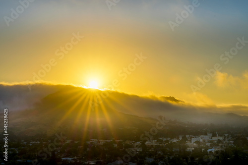 sunrise, sunset sun, sunburst, hills, town © Mark