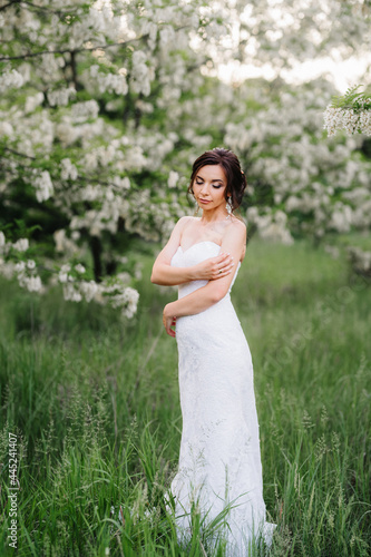 bride in a white dress with a large spring bouquet