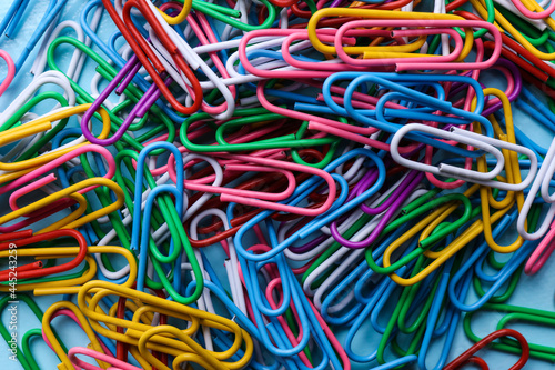 Heap of different paper clips as background  top view