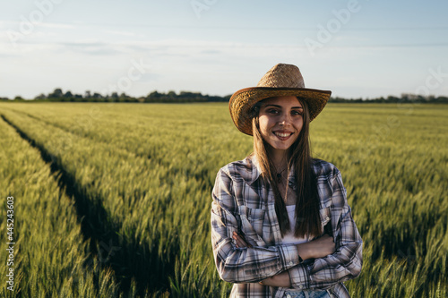 woman farmer standing in wheat filed