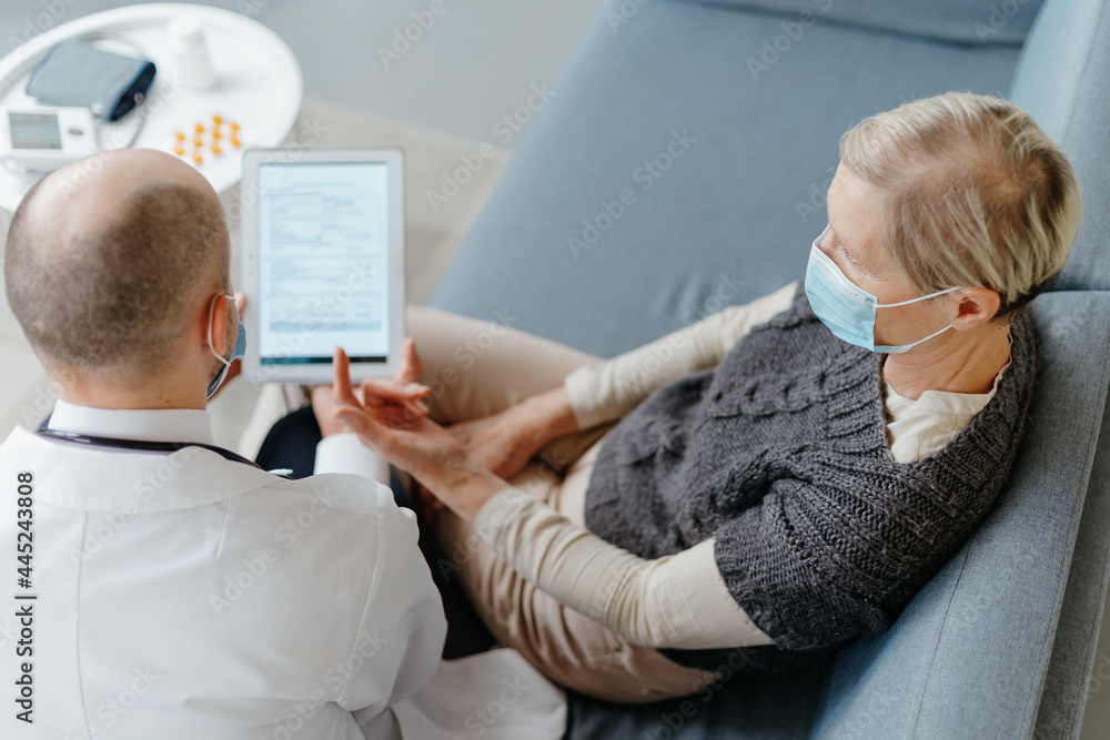 doctor and patient discussing the terms of health insurance. doctor and patient discussing the terms of health insurance.