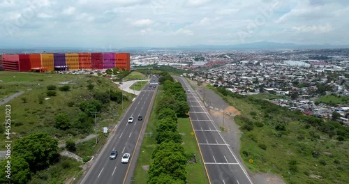 Aerial Shot of Mexican Highway with a colorful building in Queretaro, Mexico photo