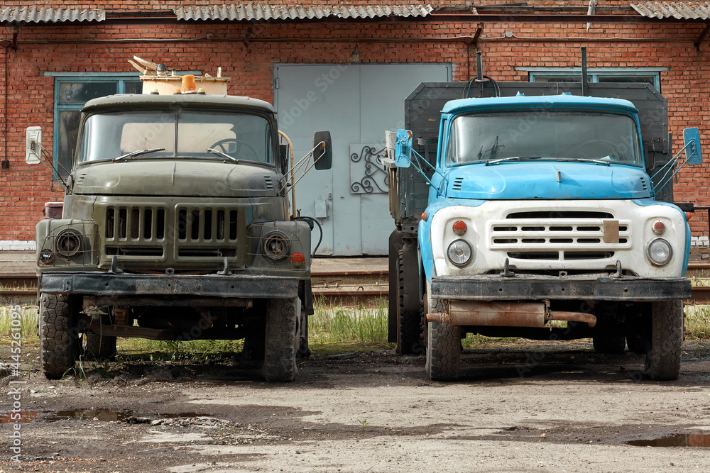 Dump of old Soviet trucks. Old rusty Soviet cars