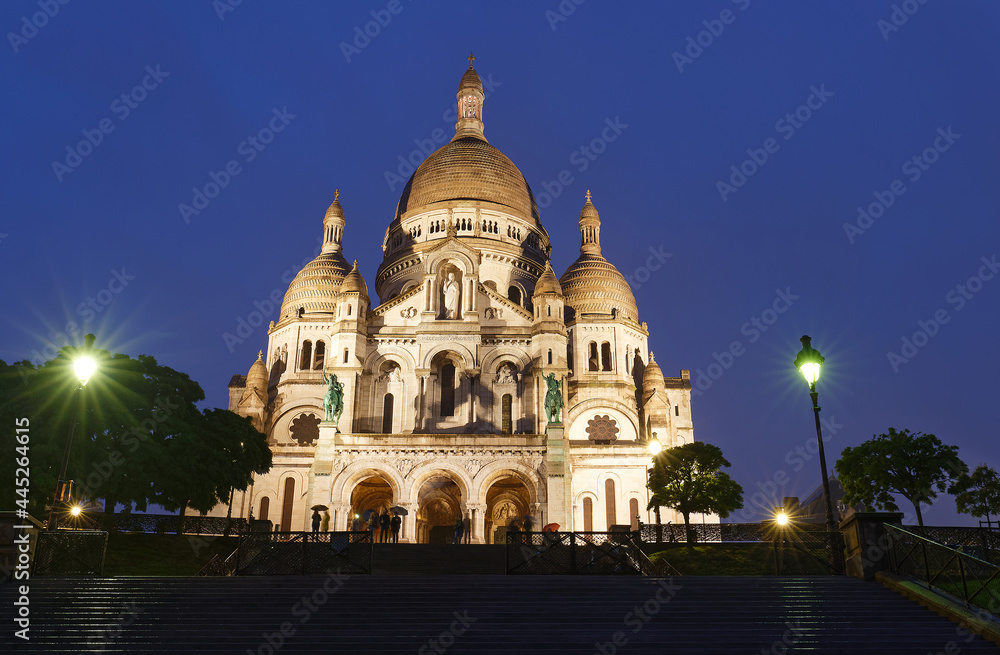 The famous basilica Sacre Coeur at rainy evening , Paris, France.