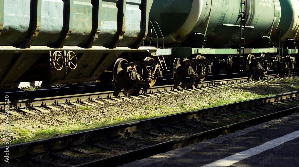Naklejka premium At the railway station there are cars and tanks of a freight train