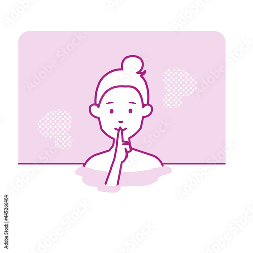 静かに黙浴をして温泉に入浴する若い女性