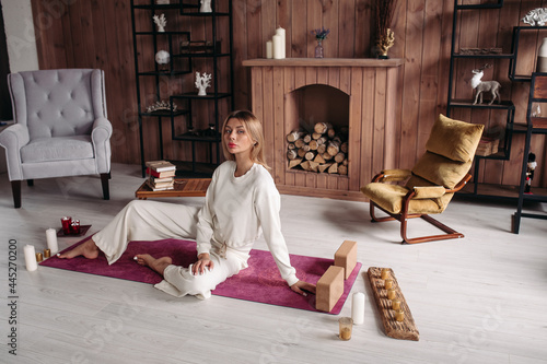 Young Caucasian woman practicing meditation at home photo